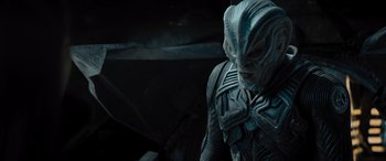 Movie still from “Star Trek Beyond” (2016), directed by Justin Lin – A man in a space suit looking down at his face; Close Up shot, Over the shoulder angle