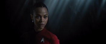 Movie still from “Star Trek Beyond” (2016), directed by Justin Lin – A woman wearing a red shirt; Close Up shot, Over the shoulder angle