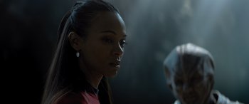 Movie still from “Star Trek Beyond” (2016), directed by Justin Lin – A person wearing a red shirt; Close Up shot, Over the shoulder angle