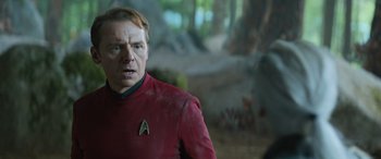 Movie still from “Star Trek Beyond” (2016), directed by Justin Lin – A man wearing a red shirt and a red shirt; Close Up shot, Over the shoulder angle