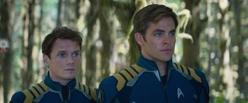 Movie still from “Star Trek Beyond” (2016), directed by Justin Lin – A man and a woman in blue and yellow uniforms; Close Up shot, Low angle