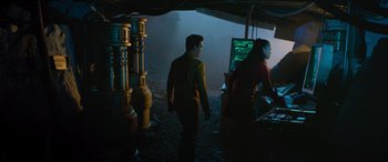 Movie still from “Star Trek Beyond” (2016), directed by Justin Lin – A man and a woman are standing in front of computer monitors; Medium shot, Over the shoulder angle