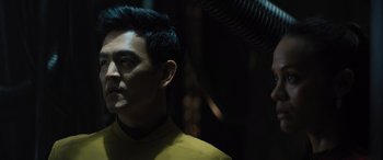 Movie still from “Star Trek Beyond” (2016), directed by Justin Lin – A person wearing a yellow shirt; Close Up shot, Over the shoulder angle