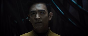 Movie still from “Star Trek Beyond” (2016), directed by Justin Lin – A person wearing a yellow shirt; Close Up shot, Over the shoulder angle