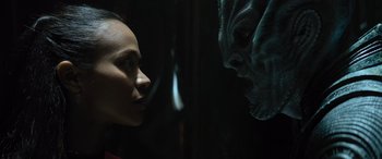 Movie still from “Star Trek Beyond” (2016), directed by Justin Lin – A woman staring at a creature in a dark room; Close Up shot, Over the shoulder angle