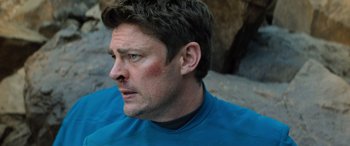 Movie still from “Star Trek Beyond” (2016), directed by Justin Lin – A person wearing a blue shirt; Close Up shot, Over the shoulder angle