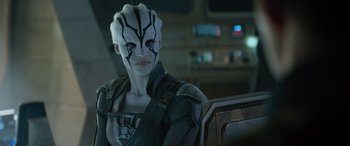 Movie still from “Star Trek Beyond” (2016), directed by Justin Lin – A woman in a space suit with a mask on; Close Up shot, Over the shoulder angle