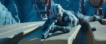 Movie still from “Star Trek Beyond” (2016), directed by Justin Lin – A person laying on the ground holding a gun; Medium shot, High angle