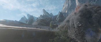 Movie still from “Star Trek Beyond” (2016), directed by Justin Lin – An image of a mountain with a car driving down the side of the road; Extreme Wide shot, High angle