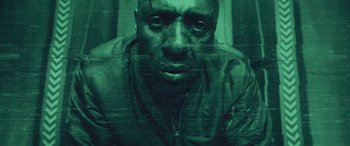 Movie still from “Star Trek Beyond” (2016), directed by Justin Lin – A man in a military uniform is looking at the camera; Close Up shot, High angle