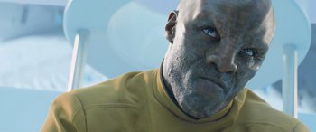 Movie still from “Star Trek Beyond” (2016), directed by Justin Lin – A man's face in a yellow shirt; Close Up shot, Low angle