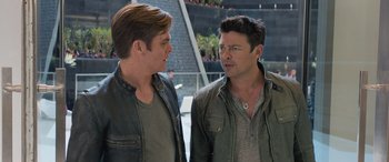 Movie still from “Star Trek Beyond” (2016), directed by Justin Lin – Two men standing next to each other in a building; Medium shot, Over the shoulder angle