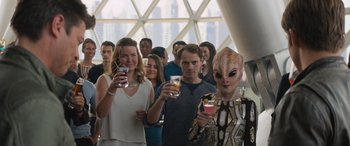 Movie still from “Star Trek Beyond” (2016), directed by Justin Lin – A group of people standing next to each other holding drinks; Medium shot, Over the shoulder angle