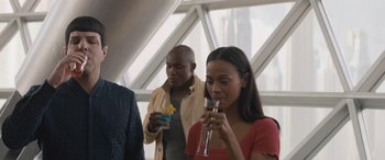 Movie still from “Star Trek Beyond” (2016), directed by Justin Lin – A man and a woman are drinking champagne; Medium shot, Over the shoulder angle