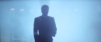 Movie still from “Star Trek II: The Wrath of Khan” (1982), directed by Nicholas Meyer – A man standing in front of a blue background; Medium shot, Low angle