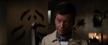 Movie still from “Star Trek II: The Wrath of Khan” (1982), directed by Nicholas Meyer – A person wearing a jacket; Close Up shot, Over the shoulder angle