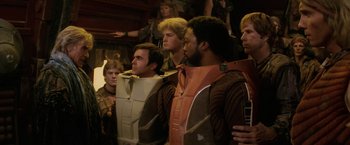 Movie still from “Star Trek II: The Wrath of Khan” (1982), directed by Nicholas Meyer – A group of men standing next to each other; Medium shot, Over the shoulder angle