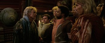 Movie still from “Star Trek II: The Wrath of Khan” (1982), directed by Nicholas Meyer – A group of people standing next to each other in a room; Medium shot, Over the shoulder angle