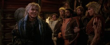 Movie still from “Star Trek II: The Wrath of Khan” (1982), directed by Nicholas Meyer – A group of people standing next to each other in a room; Medium shot, Over the shoulder angle