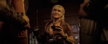 Movie still from “Star Trek II: The Wrath of Khan” (1982), directed by Nicholas Meyer – A man in a leather jacket holding a cell phone; Medium shot, Low angle