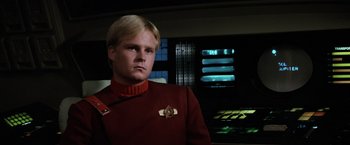 Movie still from “Star Trek II: The Wrath of Khan” (1982), directed by Nicholas Meyer – A man wearing a red shirt and a red tie; Close Up shot, Low angle