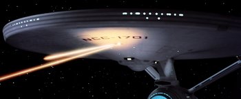 Movie still from “Star Trek II: The Wrath of Khan” (1982), directed by Nicholas Meyer – A star trek ship in the stars; Extreme Wide shot, Low angle