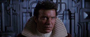 Movie still from “Star Trek II: The Wrath of Khan” (1982), directed by Nicholas Meyer – A person wearing a neck brace; Close Up shot, Low angle