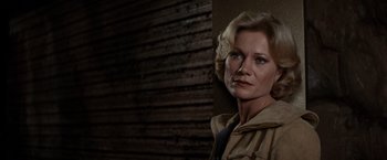 Movie still from “Star Trek II: The Wrath of Khan” (1982), directed by Nicholas Meyer – A person standing near a wooden wall; Close Up shot, Low angle