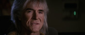 Movie still from “Star Trek II: The Wrath of Khan” (1982), directed by Nicholas Meyer – An older man with long white hair looking at the camera; Close Up shot, Over the shoulder angle