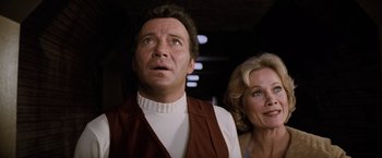 Movie still from “Star Trek II: The Wrath of Khan” (1982), directed by Nicholas Meyer – A man and a woman standing next to each other; Close Up shot, Low angle