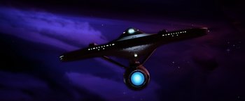 Movie still from “Star Trek II: The Wrath of Khan” (1982), directed by Nicholas Meyer – A star trek ship in the middle of the night sky; Extreme Wide shot, Low angle