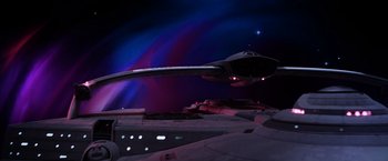 Movie still from “Star Trek II: The Wrath of Khan” (1982), directed by Nicholas Meyer – A fighter jet flying through the night sky at night; Extreme Wide shot, Low angle