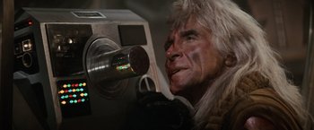 Movie still from “Star Trek II: The Wrath of Khan” (1982), directed by Nicholas Meyer – An old man with white hair looking into a machine; Close Up shot, Low angle