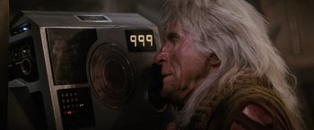 Movie still from “Star Trek II: The Wrath of Khan” (1982), directed by Nicholas Meyer – An old man with a long white hair looking into a video camera; Close Up shot, Overhead angle
