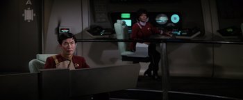 Movie still from “Star Trek II: The Wrath of Khan” (1982), directed by Nicholas Meyer – A man sitting at a computer next to a woman; Medium shot, High angle
