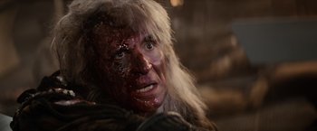 Movie still from “Star Trek II: The Wrath of Khan” (1982), directed by Nicholas Meyer – A person with blood all over their face; Close Up shot, Over the shoulder angle