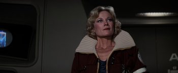 Movie still from “Star Trek II: The Wrath of Khan” (1982), directed by Nicholas Meyer – A woman with blonde hair wearing a brown jacket; Close Up shot, Low angle