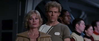 Movie still from “Star Trek II: The Wrath of Khan” (1982), directed by Nicholas Meyer – A group of people standing next to each other in a room; Close Up shot, Over the shoulder angle