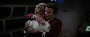 Movie still from “Star Trek II: The Wrath of Khan” (1982), directed by Nicholas Meyer – A man and a woman hugging each other in a room; Close Up shot, Over the shoulder angle