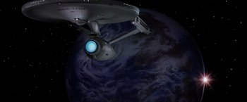 Movie still from “Star Trek II: The Wrath of Khan” (1982), directed by Nicholas Meyer – A star trek ship in front of the earth; Extreme Wide shot, Overhead angle