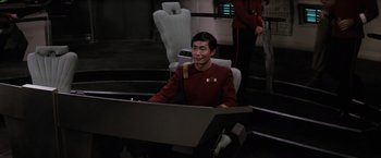 Movie still from “Star Trek II: The Wrath of Khan” (1982), directed by Nicholas Meyer – A man sitting at a computer desk in a room; Medium shot, High angle