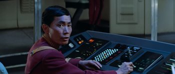 Movie still from “Star Trek III: The Search for Spock” (1984), directed by Leonard Nimoy – A man sitting in front of a computer keyboard; Close Up shot, High angle