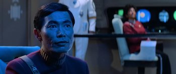 Movie still from “Star Trek III: The Search for Spock” (1984), directed by Leonard Nimoy – A man with blue makeup on his face; Close Up shot, Over the shoulder angle