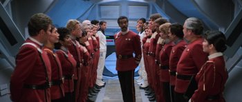 Movie still from “Star Trek III: The Search for Spock” (1984), directed by Leonard Nimoy – A group of men in red and white uniforms; Medium shot, Over the shoulder angle