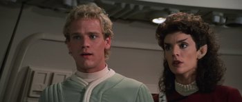 Movie still from “Star Trek III: The Search for Spock” (1984), directed by Leonard Nimoy – A man standing next to a woman in a room; Close Up shot, Over the shoulder angle