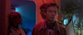 Movie still from “Star Trek III: The Search for Spock” (1984), directed by Leonard Nimoy – A man standing next to another man in a room; Close Up shot, Over the shoulder angle