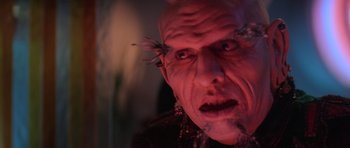 Movie still from “Star Trek III: The Search for Spock” (1984), directed by Leonard Nimoy – An old man with red eyes and a bald head; Extreme Close Up shot, Low angle
