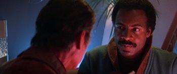 Movie still from “Star Trek III: The Search for Spock” (1984), directed by Leonard Nimoy – Two men are looking at each other in a dark room; Close Up shot, Over the shoulder angle