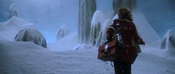 Movie still from “Star Trek III: The Search for Spock” (1984), directed by Leonard Nimoy – A man holding a briefcase walking in the snow; Wide shot, Low angle