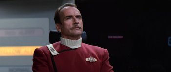 Movie still from “Star Trek III: The Search for Spock” (1984), directed by Leonard Nimoy – A man in a star trek uniform looking upward; Close Up shot, Low angle